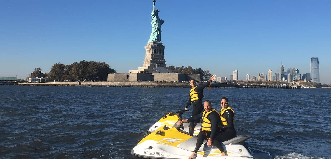 jet skiing around statue of liberty